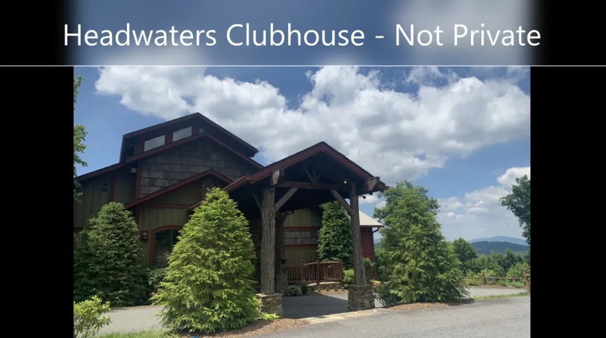 A stately clubhouse entrance framed by manicured greenery and a dramatic mountain backdrop. The building hints at the breadth of community amenities available, from fitness facilities to event spaces, inviting residents to explore all the Headwaters community has to offer.